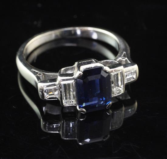 An early 20th century 18ct white gold, sapphire and diamond ring, size N.